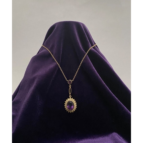 132 - A BEAUTIFUL 9CT GOLD AMETHYST AND SEED PEARL PENDANT NECKLACE, with central large oval cut vibrant a... 