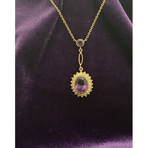 132 - A BEAUTIFUL 9CT GOLD AMETHYST AND SEED PEARL PENDANT NECKLACE, with central large oval cut vibrant a... 