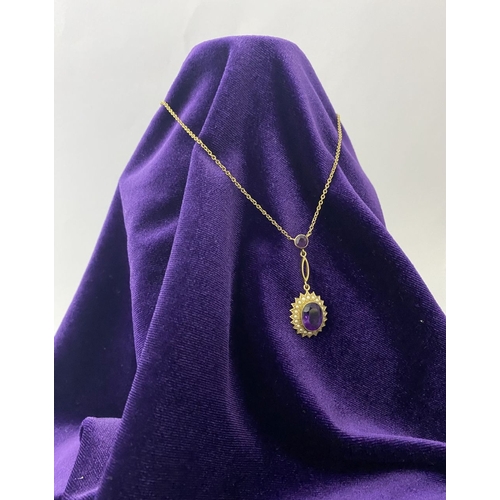 132 - A BEAUTIFUL 9CT GOLD AMETHYST AND SEED PEARL PENDANT NECKLACE, with central large oval cut vibrant a... 