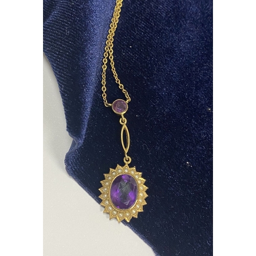 132 - A BEAUTIFUL 9CT GOLD AMETHYST AND SEED PEARL PENDANT NECKLACE, with central large oval cut vibrant a... 