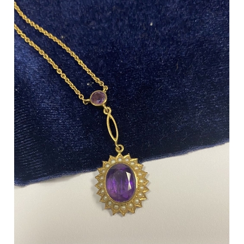 132 - A BEAUTIFUL 9CT GOLD AMETHYST AND SEED PEARL PENDANT NECKLACE, with central large oval cut vibrant a... 