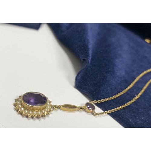 132 - A BEAUTIFUL 9CT GOLD AMETHYST AND SEED PEARL PENDANT NECKLACE, with central large oval cut vibrant a... 