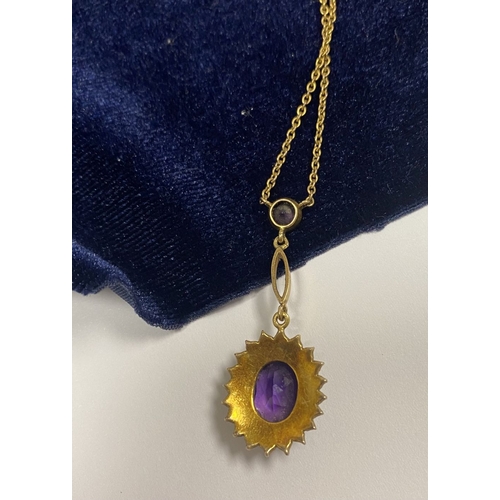 132 - A BEAUTIFUL 9CT GOLD AMETHYST AND SEED PEARL PENDANT NECKLACE, with central large oval cut vibrant a... 