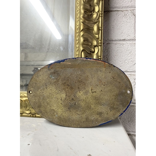 135 - A HEAVY VINTAGE BRASS SIGN, oval form, reading ‘Antiques and Collectables’. Dimensions: 29cm wide x ... 