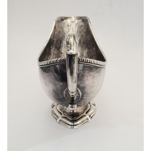 16 - AN EARLY GEORGE III IRISH SILVER SAUCE BOAT, by Richard Williams, c.1760.  Nice simple form with ree... 