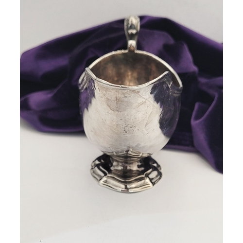 16 - AN EARLY GEORGE III IRISH SILVER SAUCE BOAT, by Richard Williams, c.1760.  Nice simple form with ree... 