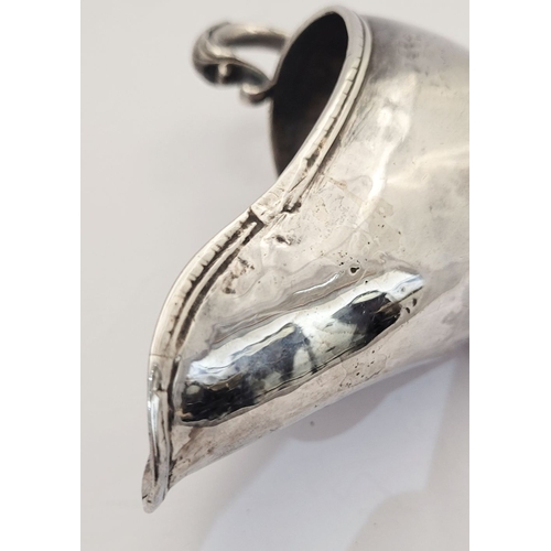 16 - AN EARLY GEORGE III IRISH SILVER SAUCE BOAT, by Richard Williams, c.1760.  Nice simple form with ree... 