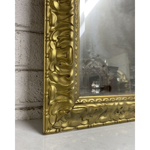 161 - A FINE CARVED GILTWOOD OVERMANTLE MIRROR, rectangular form, the frame is highly detailed. Dimensions... 