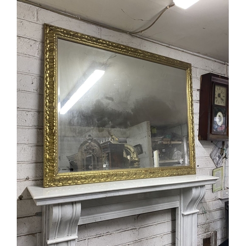 161 - A FINE CARVED GILTWOOD OVERMANTLE MIRROR, rectangular form, the frame is highly detailed. Dimensions... 