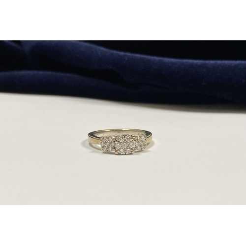 17 - A STUNNING 9CT WHITE GOLD DIAMOND CLUSTER RING, with central round cut diamond surrounded by six fur... 