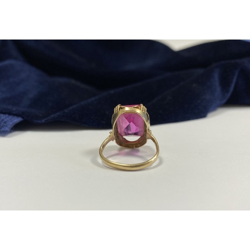 176 - A BEAUTIFUL IRISH 9CT YELLOW GOLD PINK GEMSTONE SOLITAIRE RING, with large vibrant emerald cut pink ... 