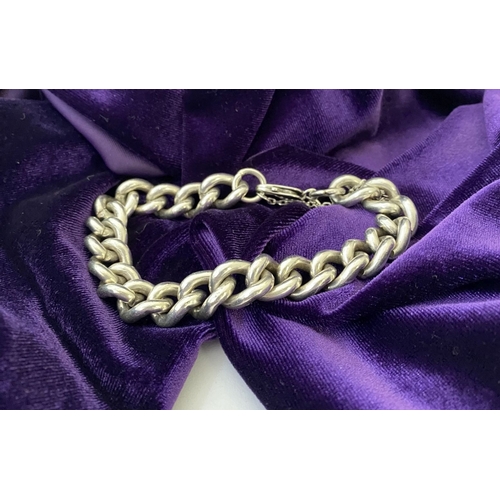 178 - A HEAVY STERLING SILVER CHAIN LINK BRACELET, complete with safety chain, hallmarked 925 to chain and... 