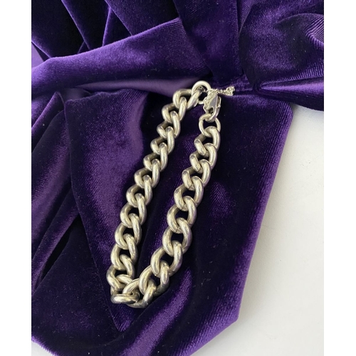 178 - A HEAVY STERLING SILVER CHAIN LINK BRACELET, complete with safety chain, hallmarked 925 to chain and... 