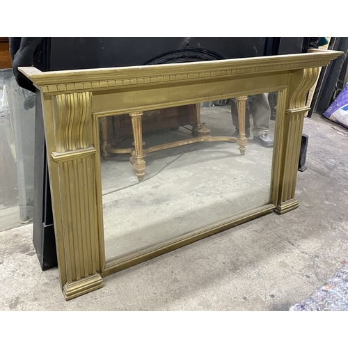 180 - A GILTWOOD OVERMANTLE MIRROR, the frame with dentil cornice, above fluted supports, on stepped base.... 