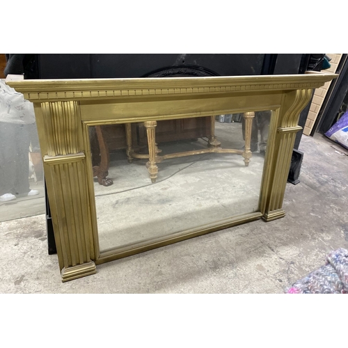 180 - A GILTWOOD OVERMANTLE MIRROR, the frame with dentil cornice, above fluted supports, on stepped base.... 