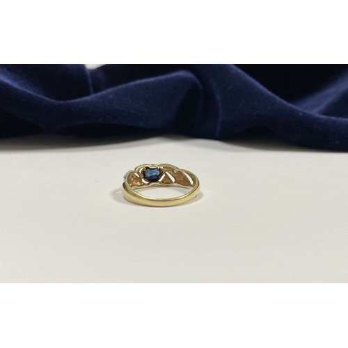 183 - A BEAUTIFUL 9CT GOLD SAPPHIRE & DIAMOND DRESS RING, with central oval cut vibrant sapphire in bezel ... 