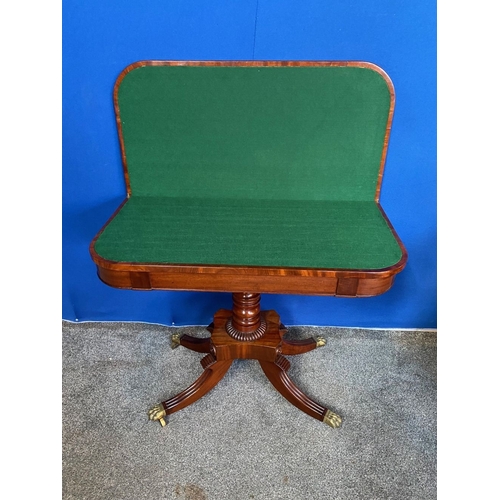 184 - A GOOD QUALITY REGENCY MAHOGANY CARD TABLE, the top with canted corners, opening to green baize line... 