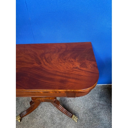 184 - A GOOD QUALITY REGENCY MAHOGANY CARD TABLE, the top with canted corners, opening to green baize line... 