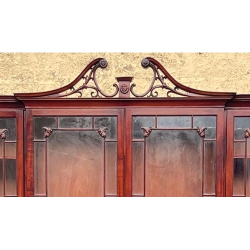 201 - AN EXCELLENT QUALITY MAHOGANY BREAKFRONT LIBRARY BOOKCASE, with openwork carved swan neck pediment t... 