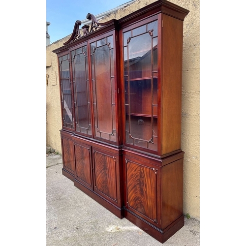 201 - AN EXCELLENT QUALITY MAHOGANY BREAKFRONT LIBRARY BOOKCASE, with openwork carved swan neck pediment t... 