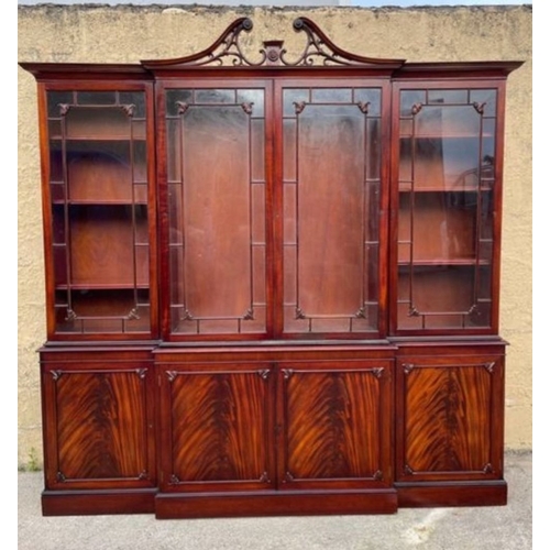 201 - AN EXCELLENT QUALITY MAHOGANY BREAKFRONT LIBRARY BOOKCASE, with openwork carved swan neck pediment t... 