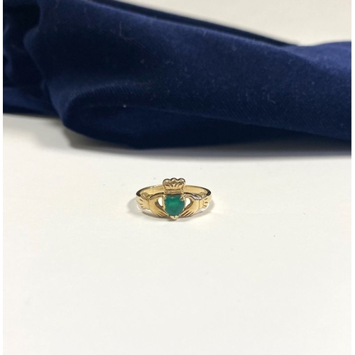 215 - A 10CT YELLOW GOLD GEMSET CLADDAGH RING, the green gemstone set to the centre in a heart shape. Ring... 