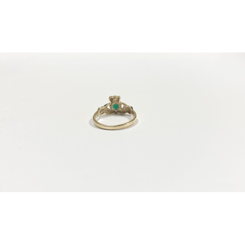 215 - A 10CT YELLOW GOLD GEMSET CLADDAGH RING, the green gemstone set to the centre in a heart shape. Ring... 