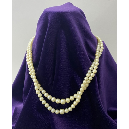 217 - TWO LOVELY IMITATION PEARL NECKLACES, (i) double strand with imitation pearls graduating in size fro... 