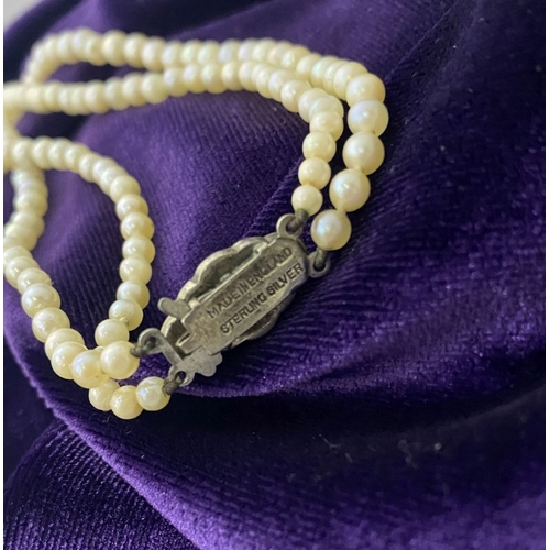 217 - TWO LOVELY IMITATION PEARL NECKLACES, (i) double strand with imitation pearls graduating in size fro... 