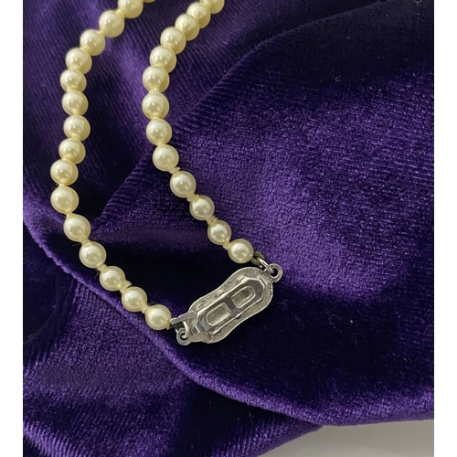 217 - TWO LOVELY IMITATION PEARL NECKLACES, (i) double strand with imitation pearls graduating in size fro... 