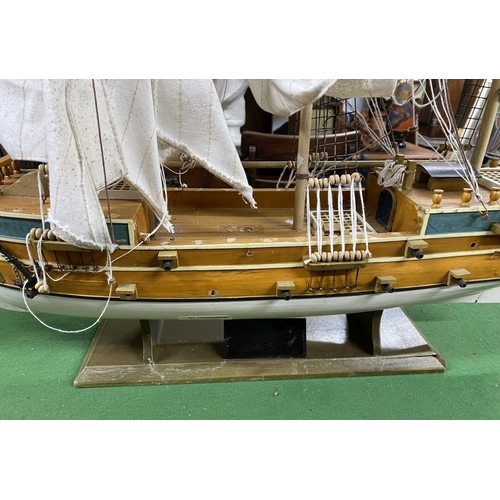 222 - A VINTAGE MODEL OF A SHIP, on base, some restoration needed, masts in need of resetting etc. Dimensi... 