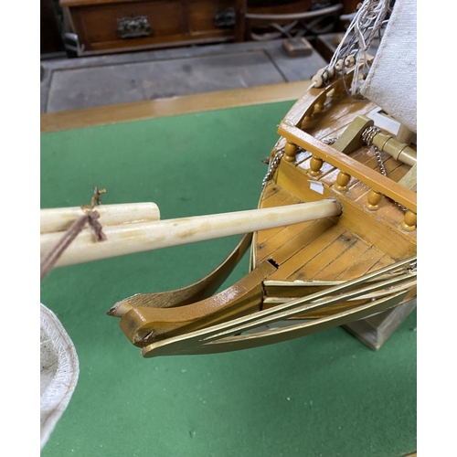 222 - A VINTAGE MODEL OF A SHIP, on base, some restoration needed, masts in need of resetting etc. Dimensi... 