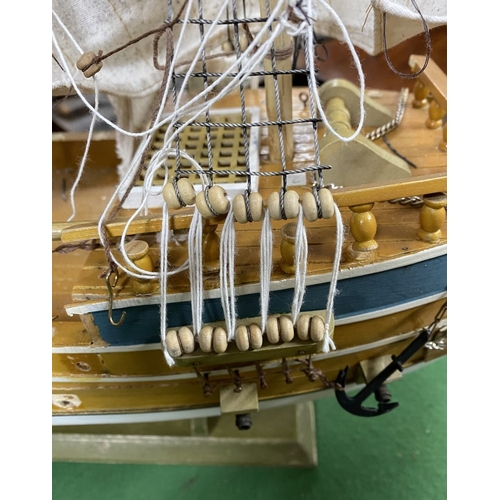 222 - A VINTAGE MODEL OF A SHIP, on base, some restoration needed, masts in need of resetting etc. Dimensi... 