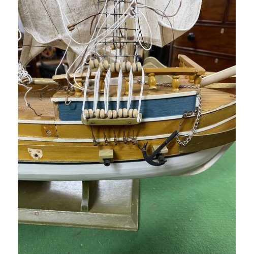 222 - A VINTAGE MODEL OF A SHIP, on base, some restoration needed, masts in need of resetting etc. Dimensi... 