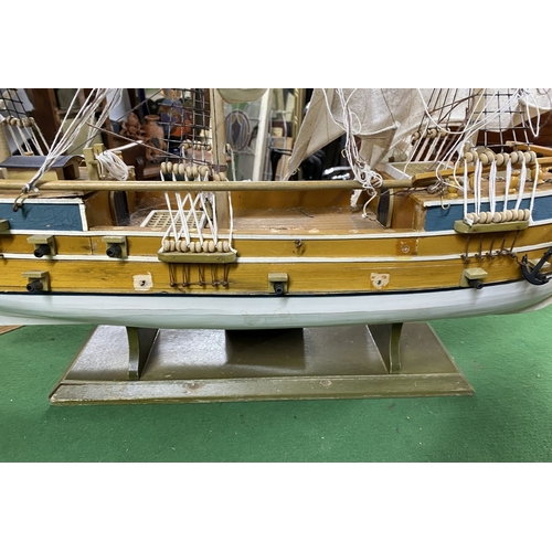 222 - A VINTAGE MODEL OF A SHIP, on base, some restoration needed, masts in need of resetting etc. Dimensi... 