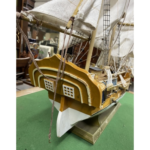 222 - A VINTAGE MODEL OF A SHIP, on base, some restoration needed, masts in need of resetting etc. Dimensi... 