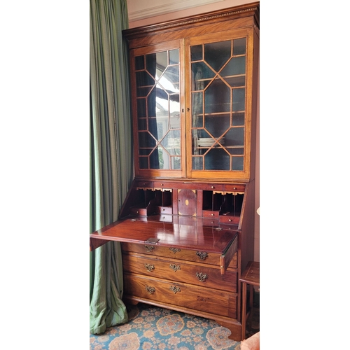 23 - A VERY FINE ASTRAGAL GLAZED GEORGIAN MAHOGANY & SATINWOOD INLAID BUREAU BOOKCASE, the top pediment w... 