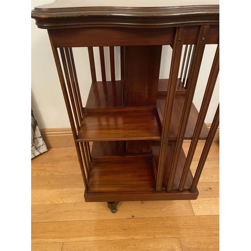 249 - A MAHOGANY INLAID REVOLVING BOOKCASE, the top with central circular inlaid panel surrounded by furth... 