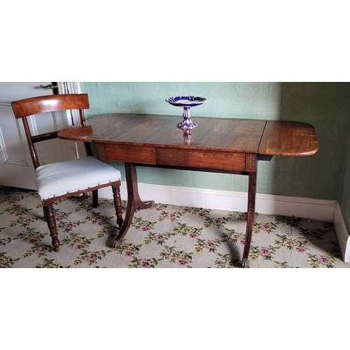 26 - A VERY GOOD QUALITY REGENCY ROSEWOOD BRASS INLAID SOFA TABLE, the curved leaves on each side raised ... 