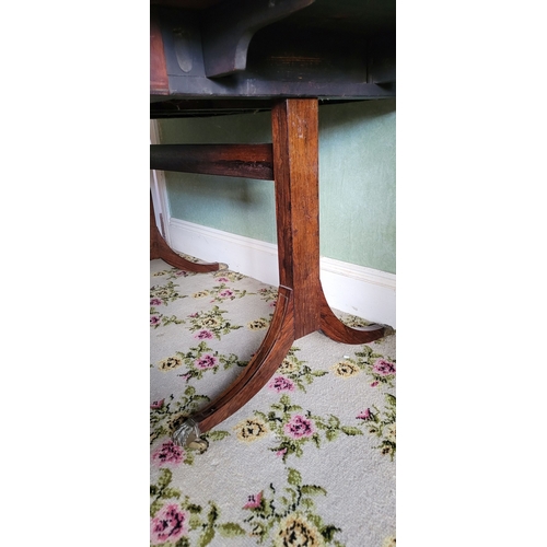 26 - A VERY GOOD QUALITY REGENCY ROSEWOOD BRASS INLAID SOFA TABLE, the curved leaves on each side raised ... 