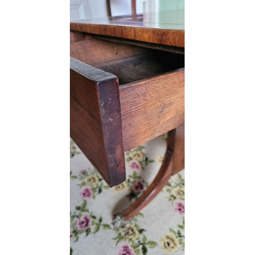 26 - A VERY GOOD QUALITY REGENCY ROSEWOOD BRASS INLAID SOFA TABLE, the curved leaves on each side raised ... 