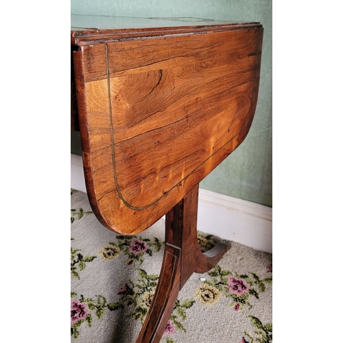 26 - A VERY GOOD QUALITY REGENCY ROSEWOOD BRASS INLAID SOFA TABLE, the curved leaves on each side raised ... 