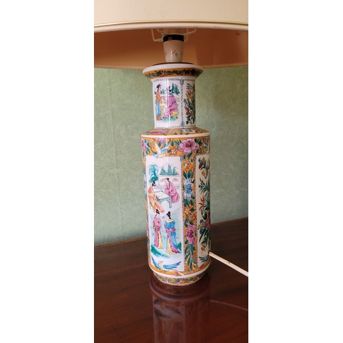 261 - A VINTAGE FAMILLE ROSE STYLE VASE TABLE LAMP, with shade, the body of the lamp ceramic with picture ... 