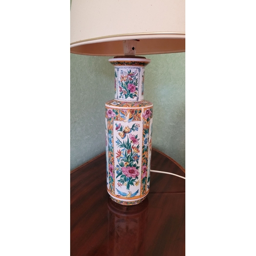 261 - A VINTAGE FAMILLE ROSE STYLE VASE TABLE LAMP, with shade, the body of the lamp ceramic with picture ... 