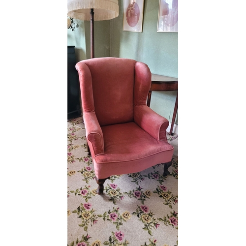 264 - TWO ANTIQUE ARMCHAIRS: (i) A WING BACKED ARMCHAIR, raised on turned leg with frill detail to the uph... 