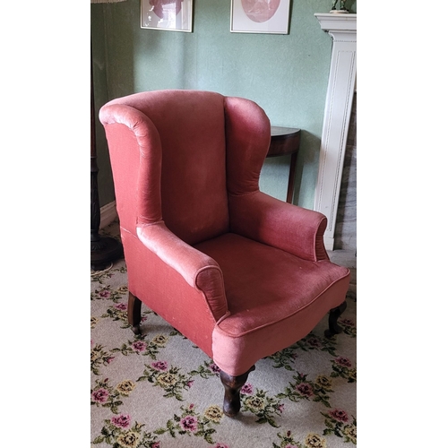 264 - TWO ANTIQUE ARMCHAIRS: (i) A WING BACKED ARMCHAIR, raised on turned leg with frill detail to the uph... 