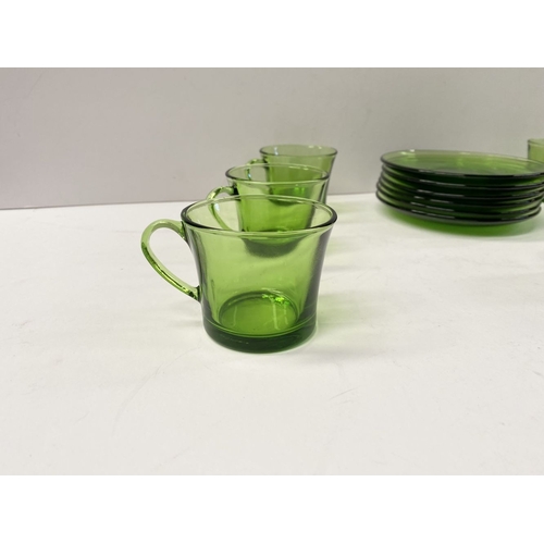 273 - A COLLECTION OF SIX FRENCH GREEN GLASS CUPS & SAUCERS, along with Dansk Designs Denmark vase. The cu... 