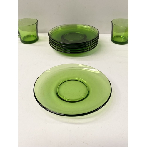 273 - A COLLECTION OF SIX FRENCH GREEN GLASS CUPS & SAUCERS, along with Dansk Designs Denmark vase. The cu... 