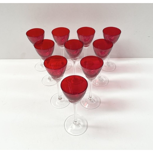 274 - A SET OF TEN VINTAGE RUBY GLASS TWIST STEM LIQUOR GLASSES, ruby glasses with lovely spiral design to... 