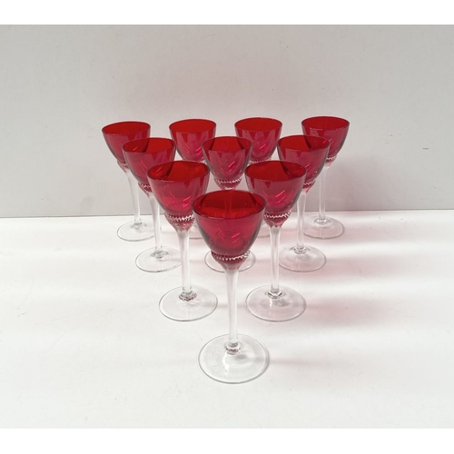 274 - A SET OF TEN VINTAGE RUBY GLASS TWIST STEM LIQUOR GLASSES, ruby glasses with lovely spiral design to... 